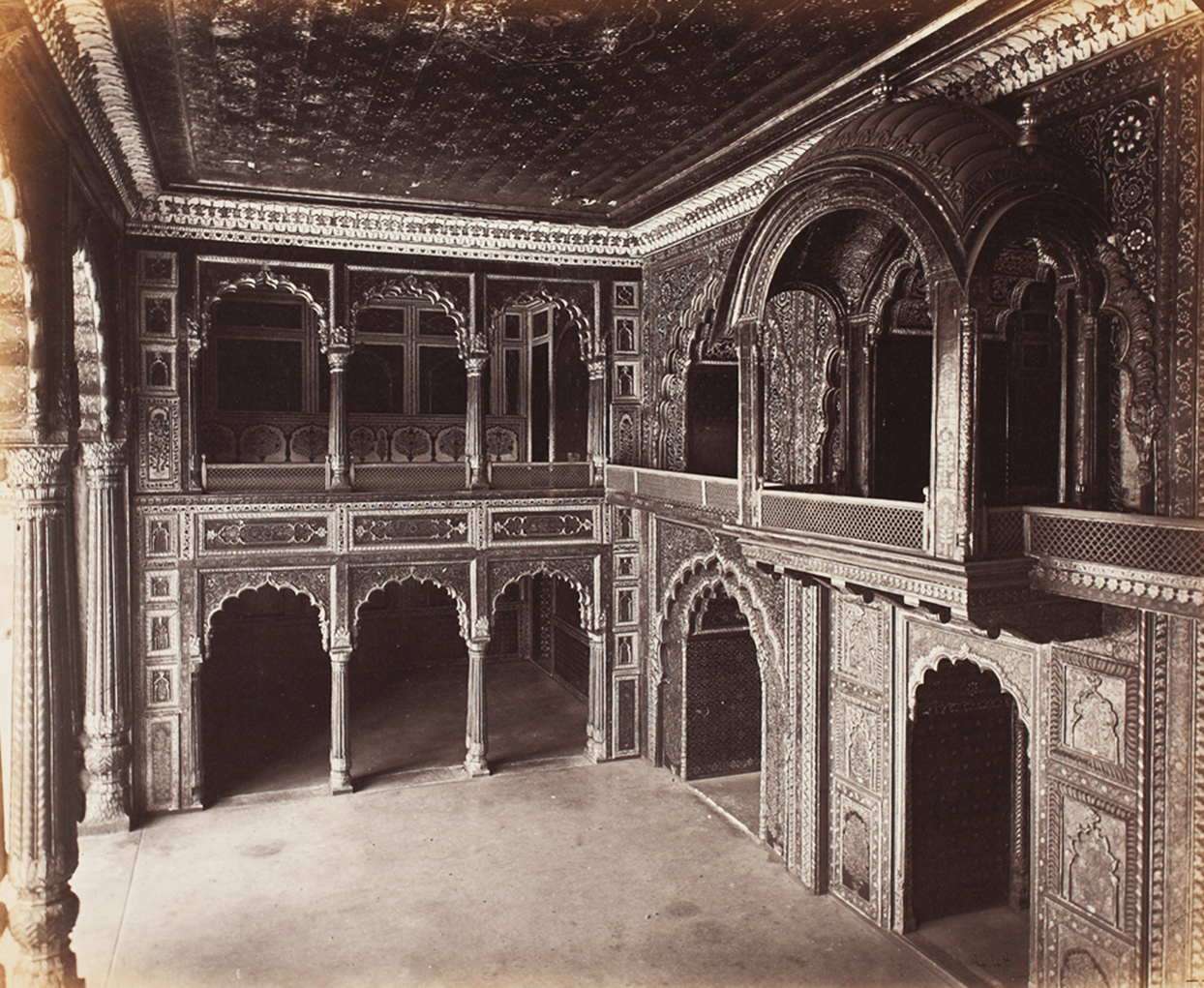Black and White photograph of an intricate arcade and pavilion of the teakwod palace Darya Daulat Bagh, Srirangapatna